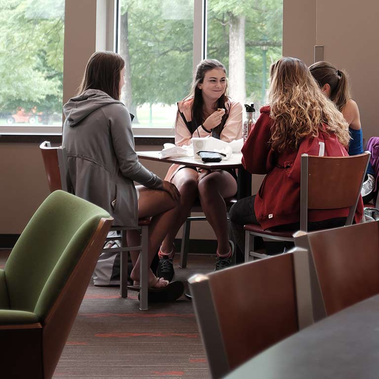 Four students having a conversation