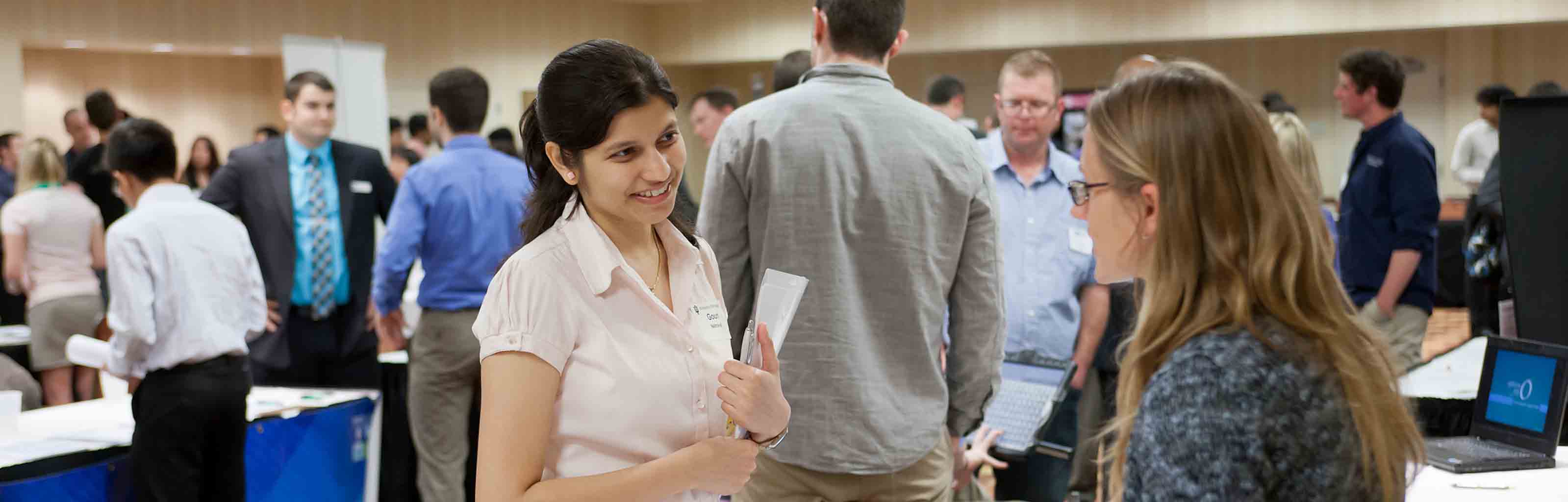 People gather at an internship fair
