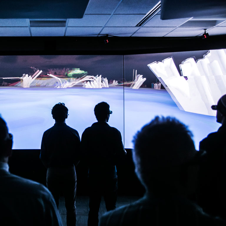 Students in front of a 3D wall